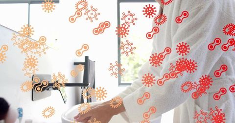 Man washing hands in white robe with virus overlay in modern bathroom hygiene concept