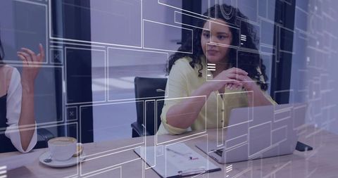 Professional Team in Modern Office Discussing Digital Charts