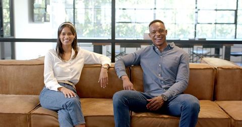 Casual business break with relaxed colleagues on couch