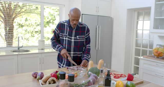 Senior Man Preparing Healthy Meal in Bright Modern Kitchen - Download Free Stock Images Pikwizard.com