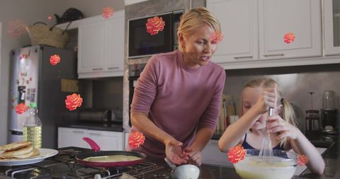 Mother and Daughter Enjoying Cooking Together With Animated Flowers