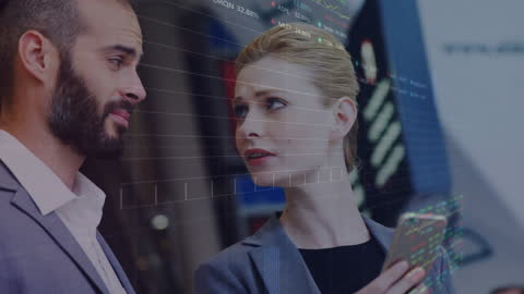 Business Professionals Discussing Financial Data with Digital Overlays