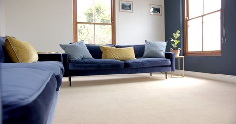 Modern Living Room with Blue Sofas and Minimalist Design - Download Free Stock Images Pikwizard.com