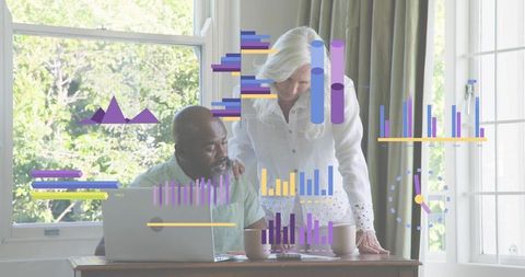 Senior couple collaborating on home data analysis with laptop and infographic visualization