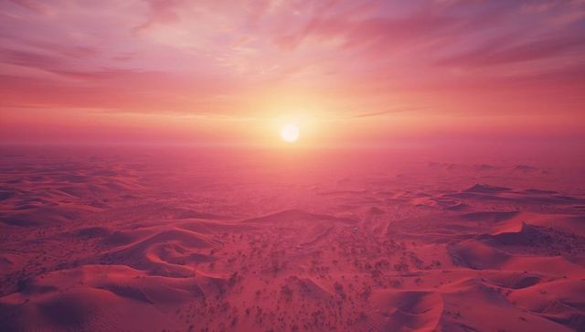 Vibrant Sunset Over Expansive Desert with Dunes