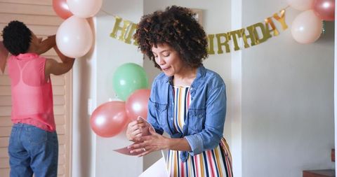 Diverse Couple Celebrating Birthday with Festive Decorations at Home