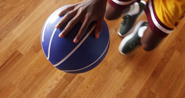 Basketball player practicing dribbling drill in the court indoors - Download Free Stock Photos Pikwizard.com