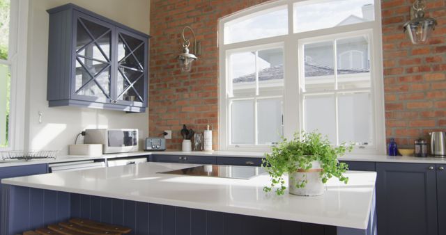 Modern Kitchen with Blue Cabinets and White Countertops - Download Free Stock Photos Pikwizard.com