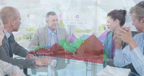 Business team analyzing growth charts in modern office meeting