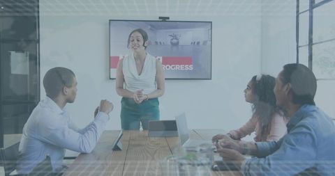Woman Presenting to Team in Modern Boardroom Leading Strategy Meeting Collaboration