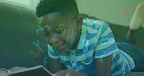Young boy reading with numbers and letters overlay