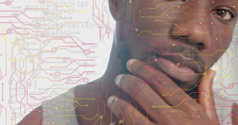 Contemplating man touching chin with circuit overlay, futuristic digital portrait on white backdrop