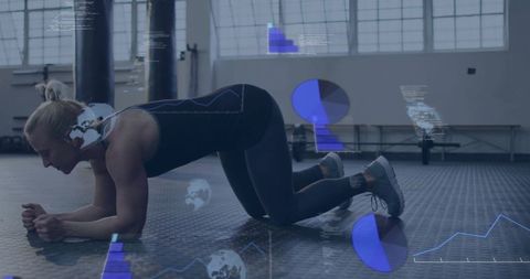 Mid-adult woman holding plank on gym floor with ar fitness data overlay for core training
