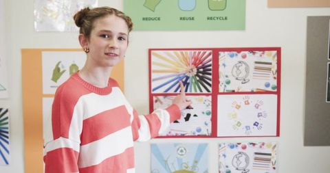 Girl Student Presenting Color Wheel in Innovative Classroom