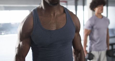 Dedicated Athletes Building Strength in Modern Gym