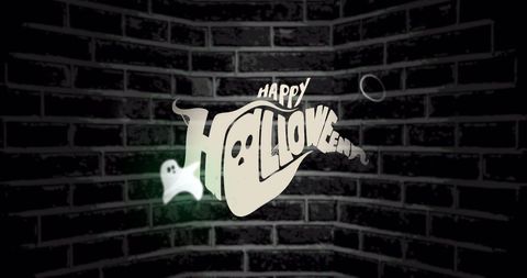 Happy halloween text on dark brick wall background