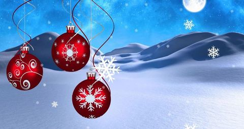 Hanging Red Christmas Baubles Swinging over Moonlit Snow Dunes