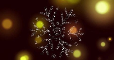 Sparkling snowflake ornament glowing on dark maroon background with warm bokeh lights