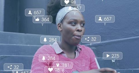 Young woman surrounded by social media alerts getting popular