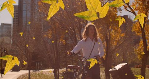 Biking through Autumn Leaves in Urban Park