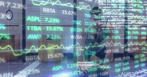 Analyzing transparent market data overlay on glass partition reflecting trader in office