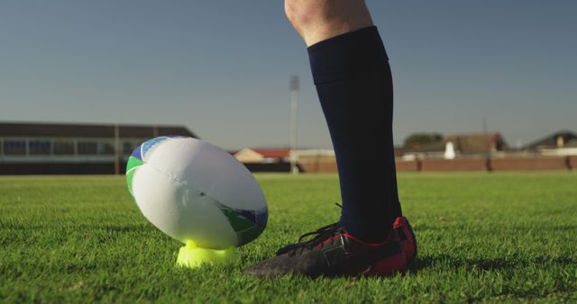 Player Preparing to Kick Rugby Ball on Field - Download Free Stock Images Pikwizard.com