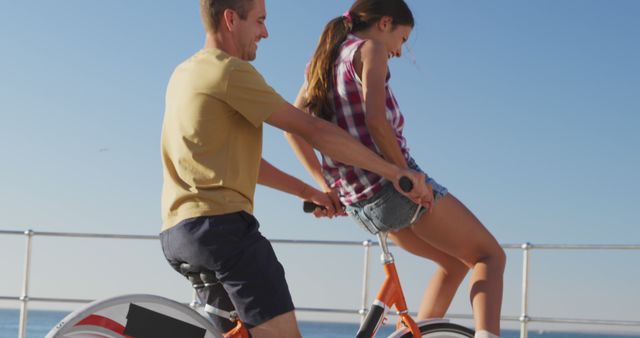 Happy Couple Riding Tandem Bicycle by Ocean - Download Free Stock Images Pikwizard.com