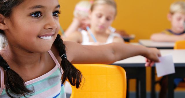 Children Passing Notes in Class with Smiling Girl in Foreground - Download Free Stock Images Pikwizard.com