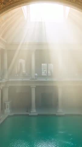 Streaming Sunlight Through Skylight Over Historic Atrium Pool Vertical Video