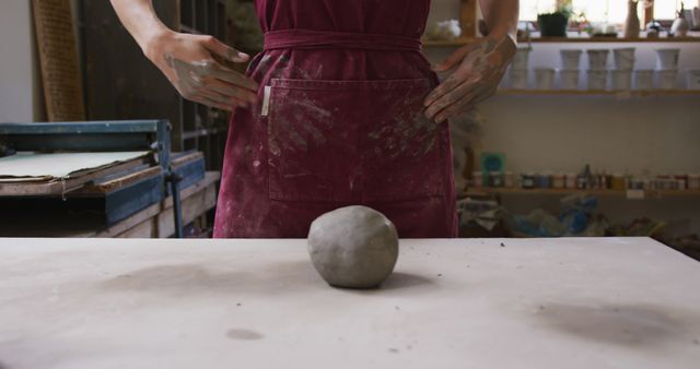 Person Wearing Dirty Apron Preparing to Sculpt Clay in Studio - Download Free Stock Images Pikwizard.com