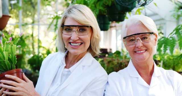 Senior Female Scientists Working in Greenhouse Smiling - Download Free Stock Images Pikwizard.com