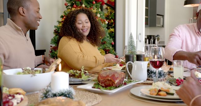 Family Enjoying Christmas Dinner Around Table with Festive Decorations - Download Free Stock Images Pikwizard.com