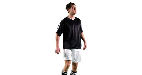 An athlete, wearing a black jersey and white shorts, stands confidently as if getting ready for a game. His determined expression conveys focus and readiness, creating a motivational vibe. This can be used in sports advertising, promotional material, or motivational content about athleticism and teamwork.