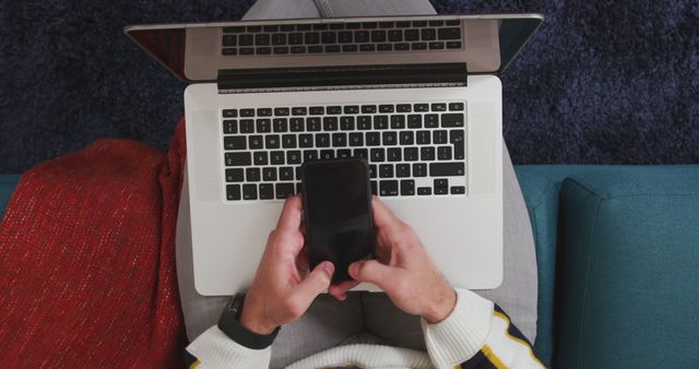 Person Using Smartphone and Laptop on Couch - Download Free Stock Images Pikwizard.com