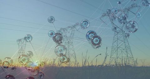 Smart grid network overlay connecting high-voltage transmission towers in sunset meadow