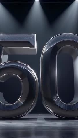 Zooming vertical video of 3D chrome 50 under spotlights for anniversary promo and branding