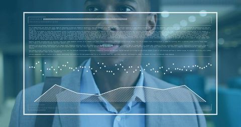 Middle-aged executive reviewing holographic data dashboard with analytics visualization