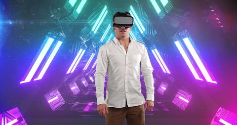 Man Experiencing Virtual Reality in Neon Tunnel