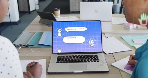 Diverse Businesswomen Collaborating with AI Chat on Laptop