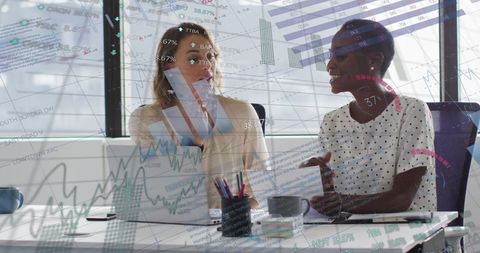 Business professionals discussing analytics data in bright office