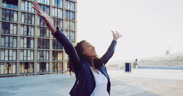 Joyous Young Woman Celebrating Outdoors in Urban Setting - Download Free Stock Images Pikwizard.com