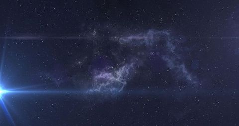 Stretching nebula crossing deep space with blue star flare and starfield