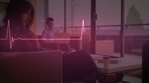 Diverse Professionals Discuss Strategy with Futuristic Cardiograph Overlay