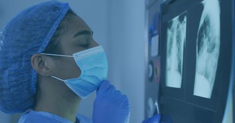 Healthcare Professional Reviewing Medical X-rays in Hospital Room - Download Free Stock Images Pikwizard.com