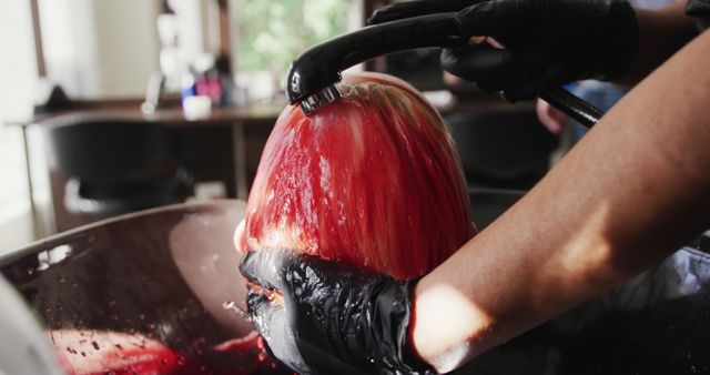 Hairdresser Rinsing Red Hair Dye from Woman's Hair at Salon - Download Free Stock Images Pikwizard.com