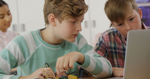 Curious Boys Engaging in STEM Project on Laptop in Classroom - Download Free Stock Images Pikwizard.com