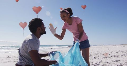 Eco-friendly couple enjoying beach cleanup with heart icons