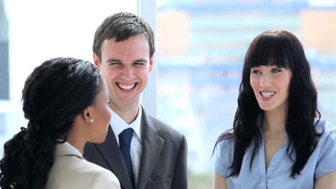 Diverse Business Team Engaging in Light-hearted Discussion