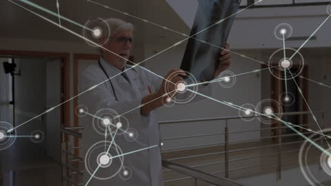 Senior Doctor Examining X-Ray with Digital Network Overlay