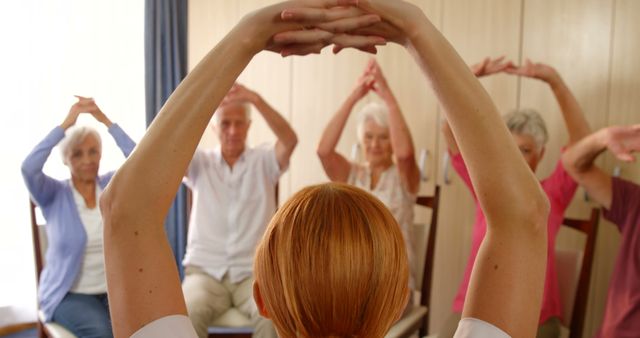 Senior Citizens Exercising with Instructor in Fitness Class - Download Free Stock Images Pikwizard.com